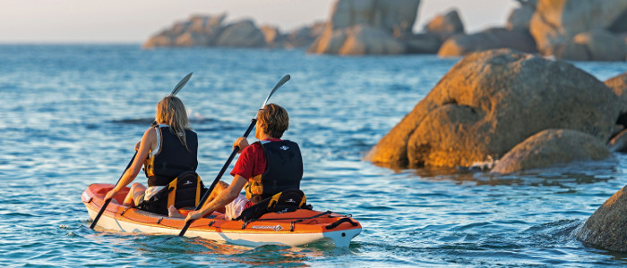 Two people in a kayak on the ocean